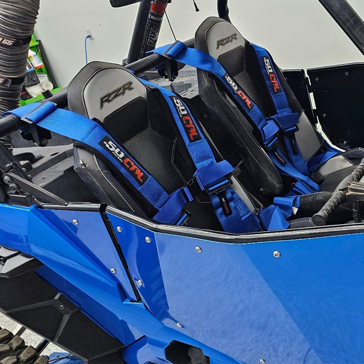 Nitro Blue | 50 Caliber Racing Pro Series 4-point UTV harness installed on UTV seat Blue