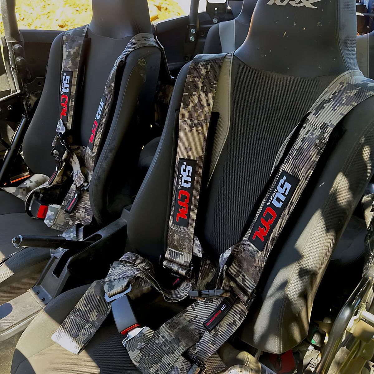 Carbon Camo | 50 Caliber Racing Pro Series 4-point UTV harness installed on UTV seat Camo