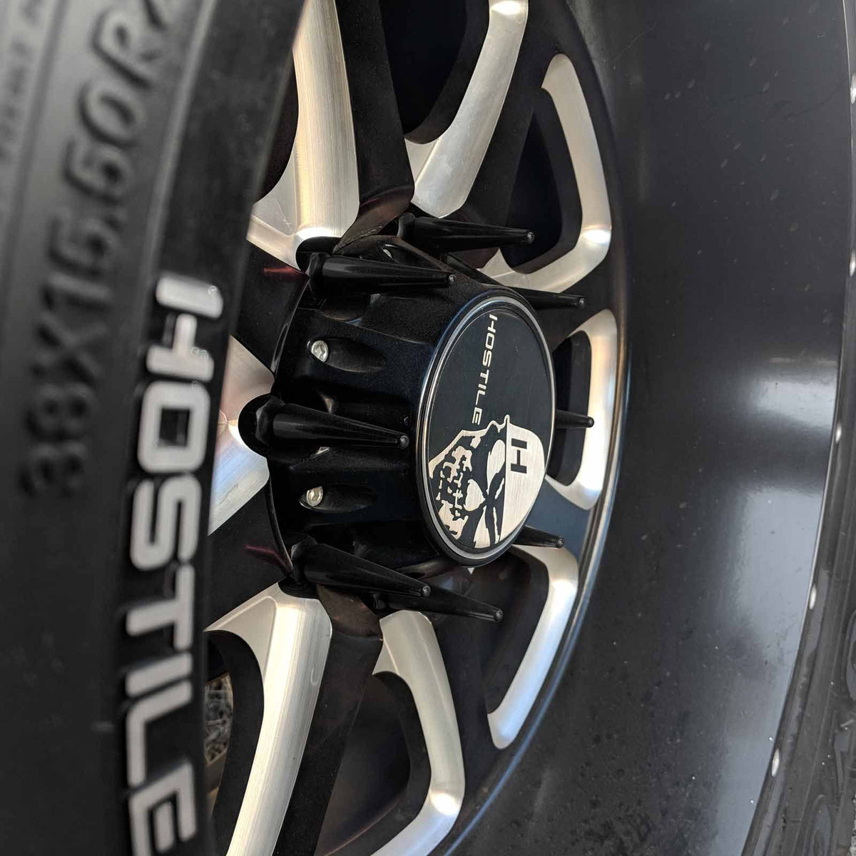 Black | 14x2.0 Extended Spike Lug Nuts - Acorn Taper - 50 Caliber Racing - Black Spikes Installed