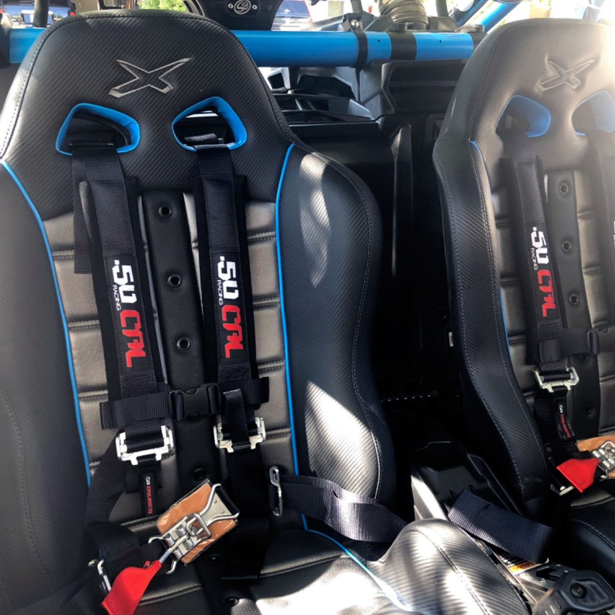 Stealth Black | Black 4 Point UTV Harness 3 Inch Straps Latch Style Quick Release Installed in RZR SXS