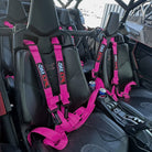 Rogue Pink | Pink 4-point UTV harness, 3" main straps, latch-style quick release, shown installed in UTV