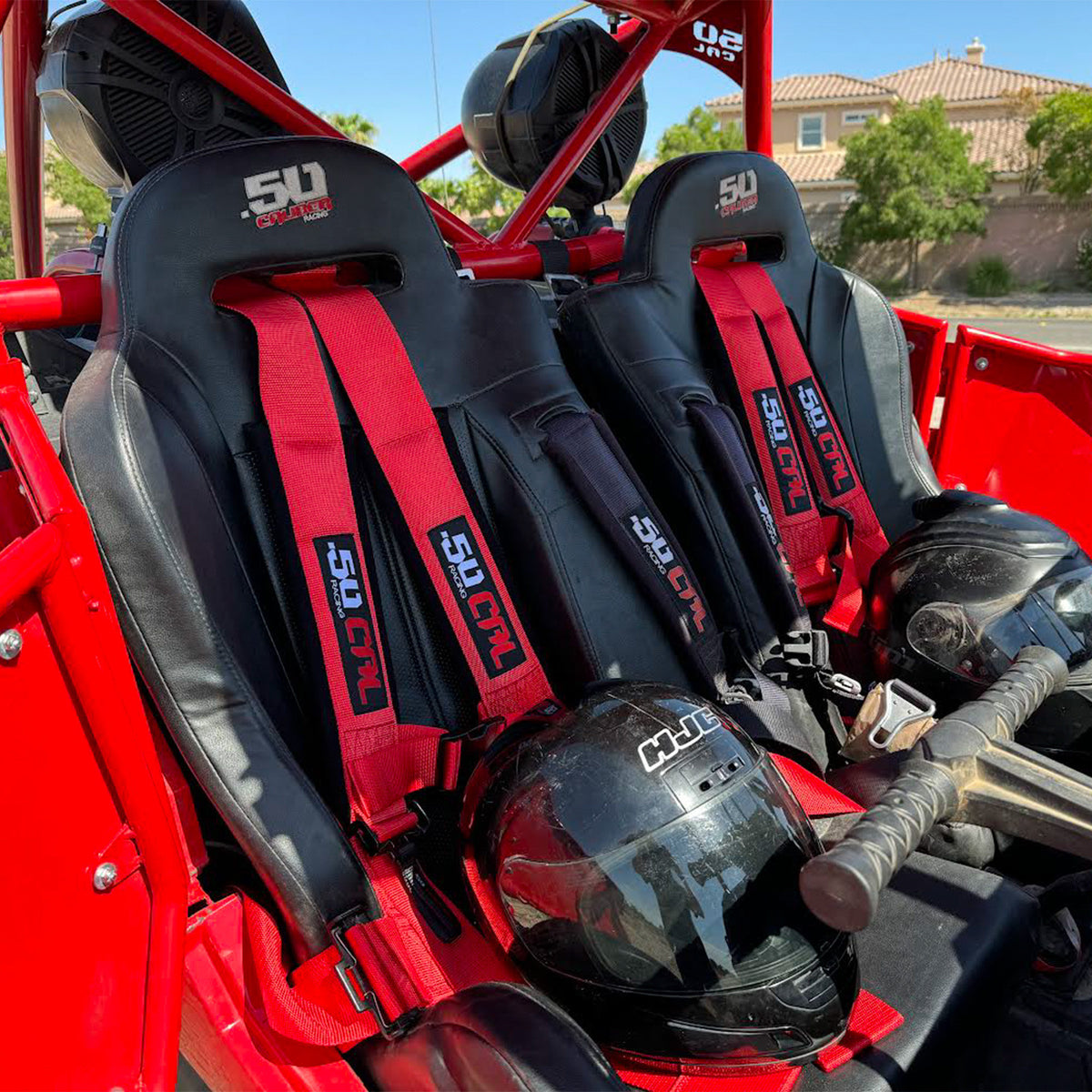 Rage Red | Red 4-point UTV harness, 3" main straps, latch-style quick release, shown installed in Polaris RZR