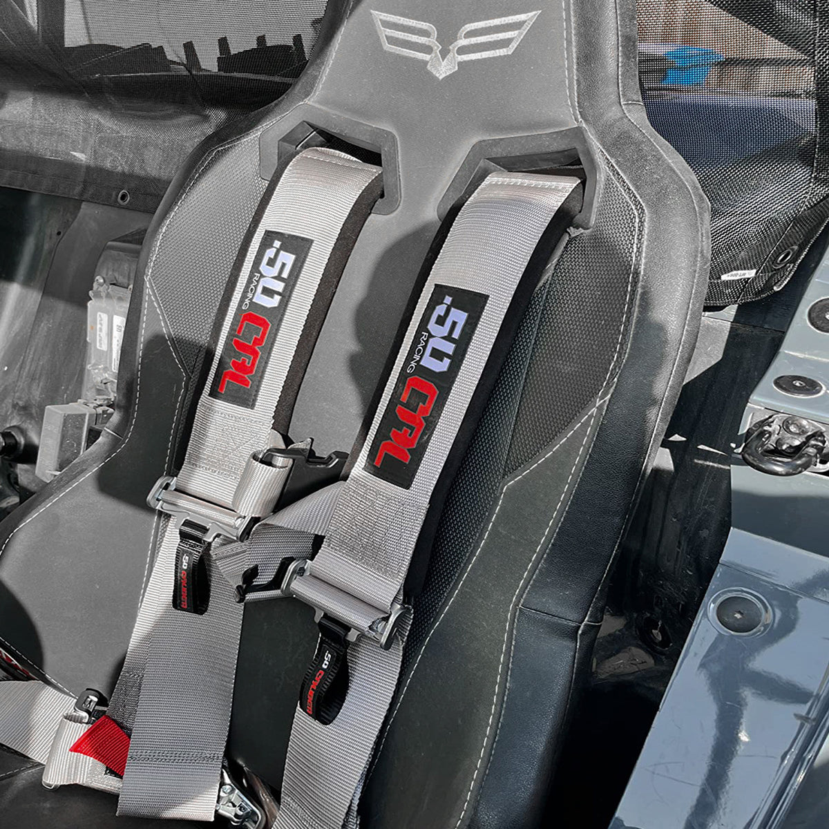 Ghost Gray | Silver 4-point UTV harness, 3" main straps, latch-style quick release, shown installed in UTV