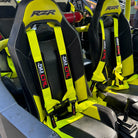Highlighter Yellow | Yellow | 50 Caliber Racing Pro Series 4-point UTV harness installed on UTV seat Yellow