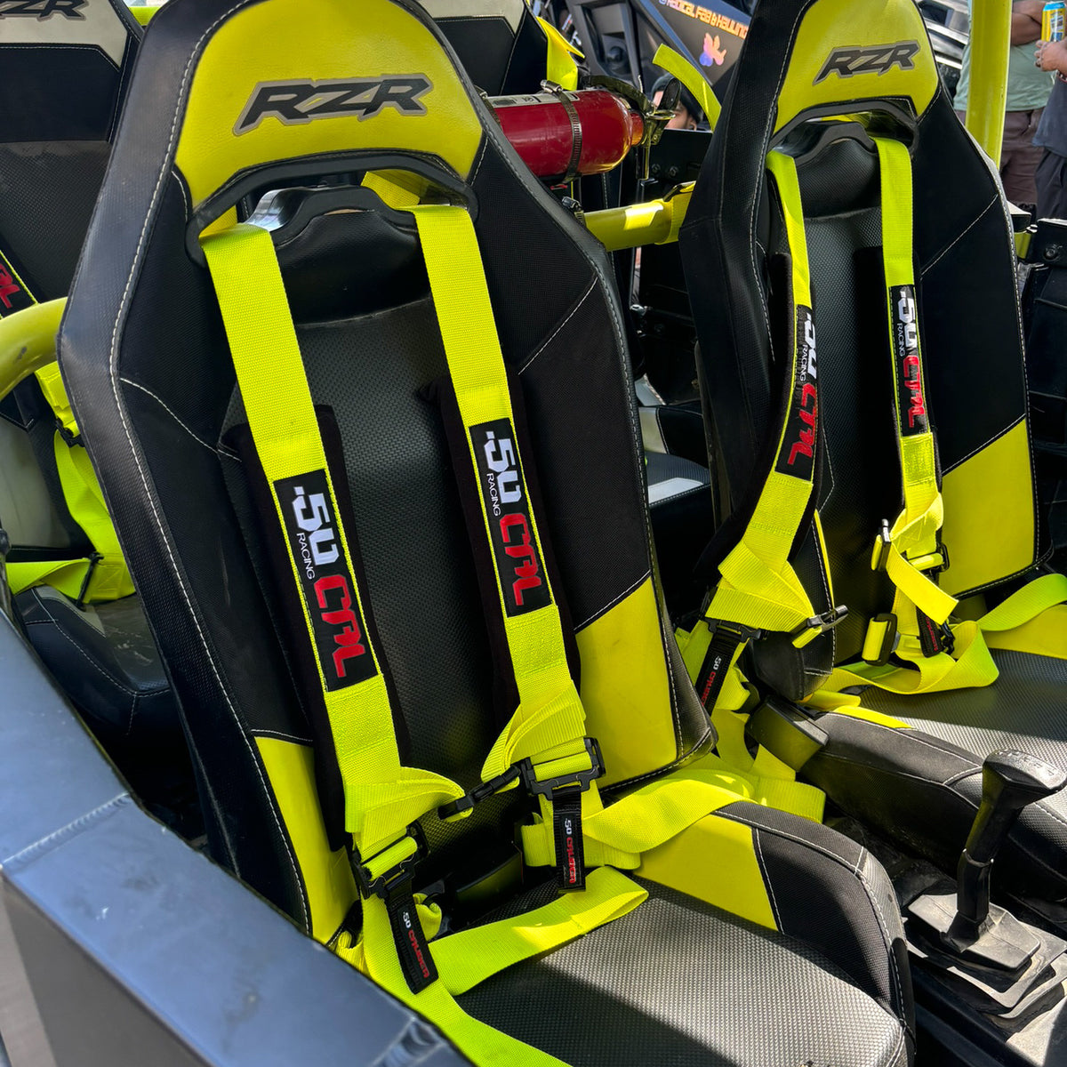 Highlighter Yellow | Yellow | 50 Caliber Racing Pro Series 4-point UTV harness installed on UTV seat Yellow