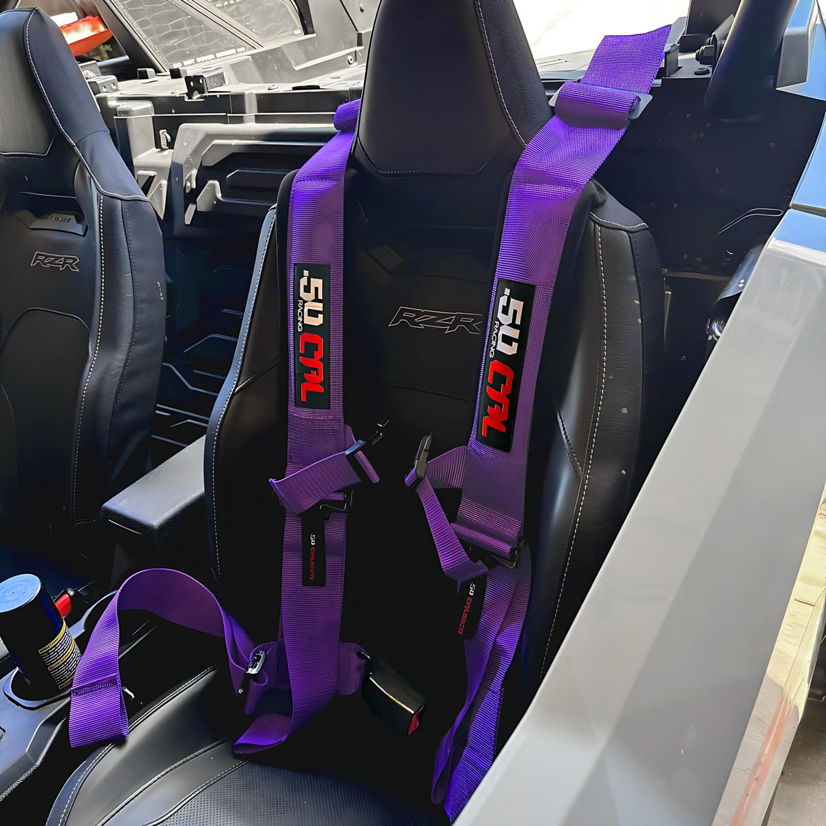 Purple | 50 Caliber Racing Pro Series 4-point UTV harness installed on UTV seat Purple
