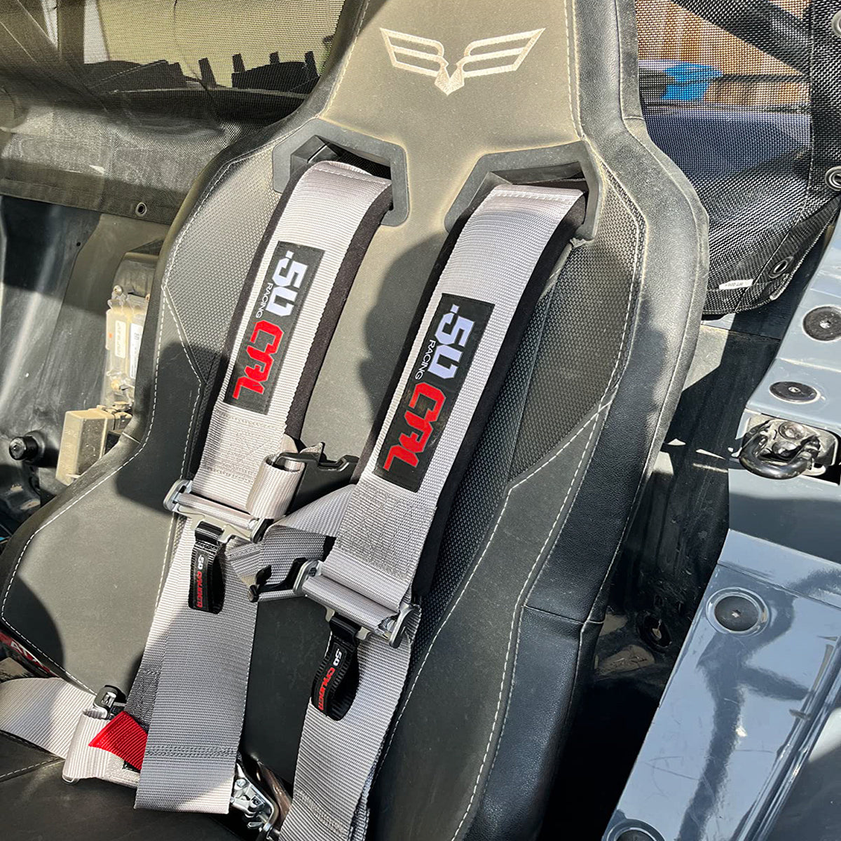 Ghost Gray | Silver | 50 Caliber Racing Pro Series 4-point UTV harness installed on UTV seat Silver