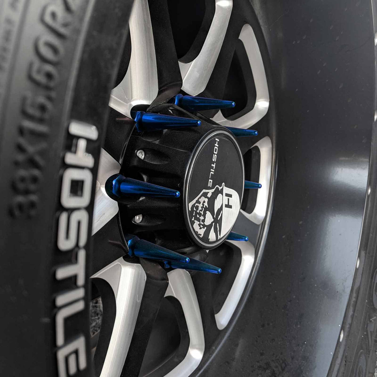 Blue | 14x2.0 Extended Spike Lug Nuts - Acorn Taper - 50 Caliber Racing - Blue Spikes Installed